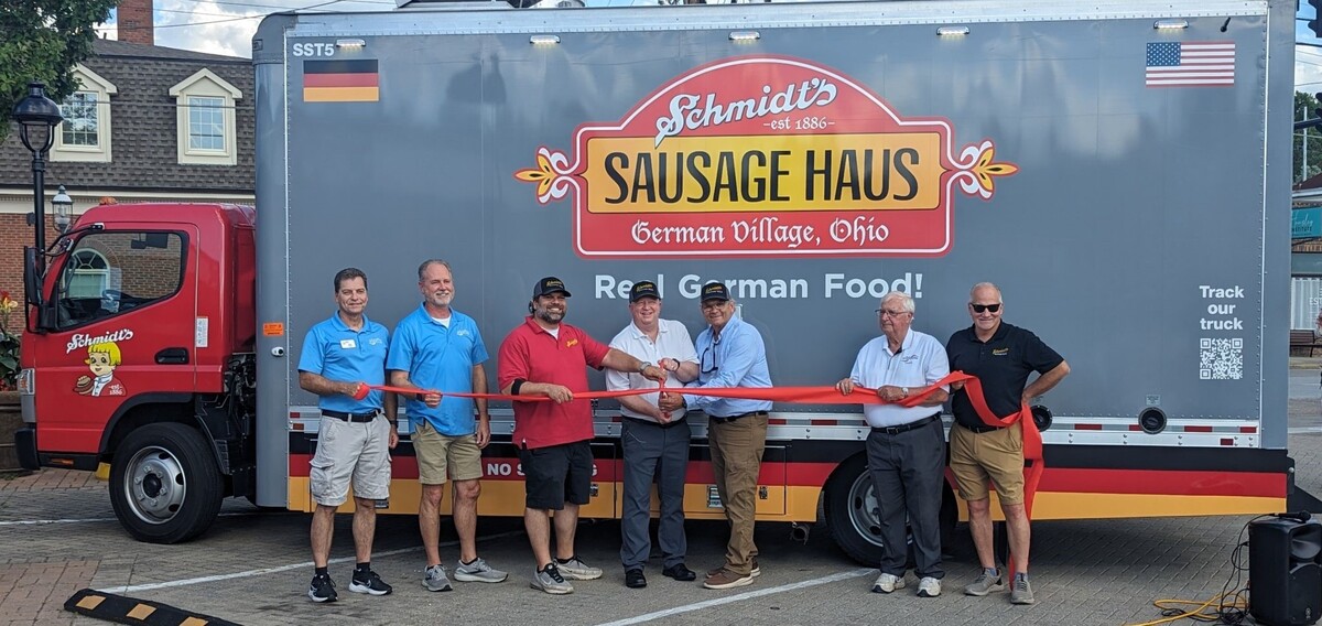 Schmidt's Sausage Haus ribbon cutting in front of truck